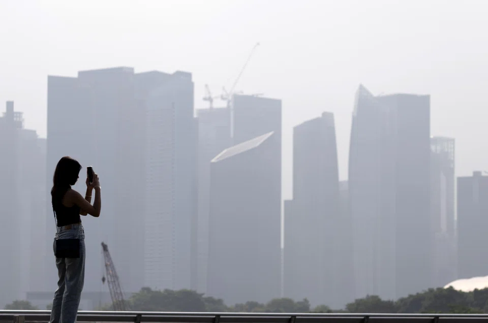 Singapore's skyline shrouded with haze on Oct 10.  Even as finger-pointing
is a common response during such
episodes, solving the issue involves 
real and enduring concerns. 