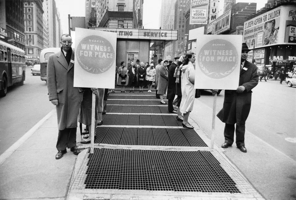 Quakers at a prayer vigil in front of the armed forces recruitment booth in Times Square, New York City, in 1961.