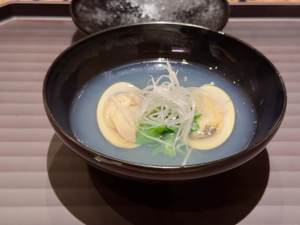 Clear dashi broth with hamaguri, a Japanese clam.