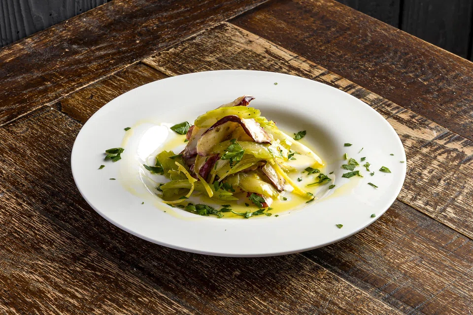 Marinated octopus and celery in lemon vinaigrette.