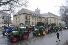 Farmers in Poland block a road with tractors during a protest on Feb 9. Recent weeks have seen such protests across Europe, fuelled by discontent over various issues including some green policies.