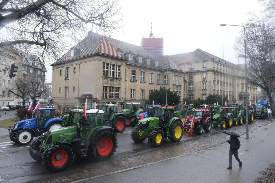 Farmers in Poland block a road with tractors during a protest on Feb 9. Recent weeks have seen such protests across Europe, fuelled by discontent over various issues including some green policies.