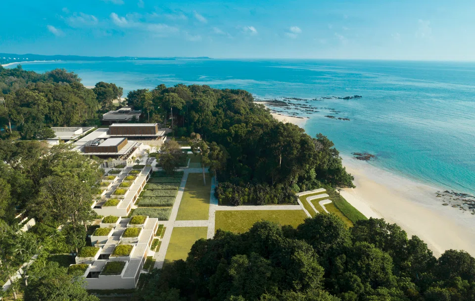 The low-rise resort is set against natural forest and the South China Sea.