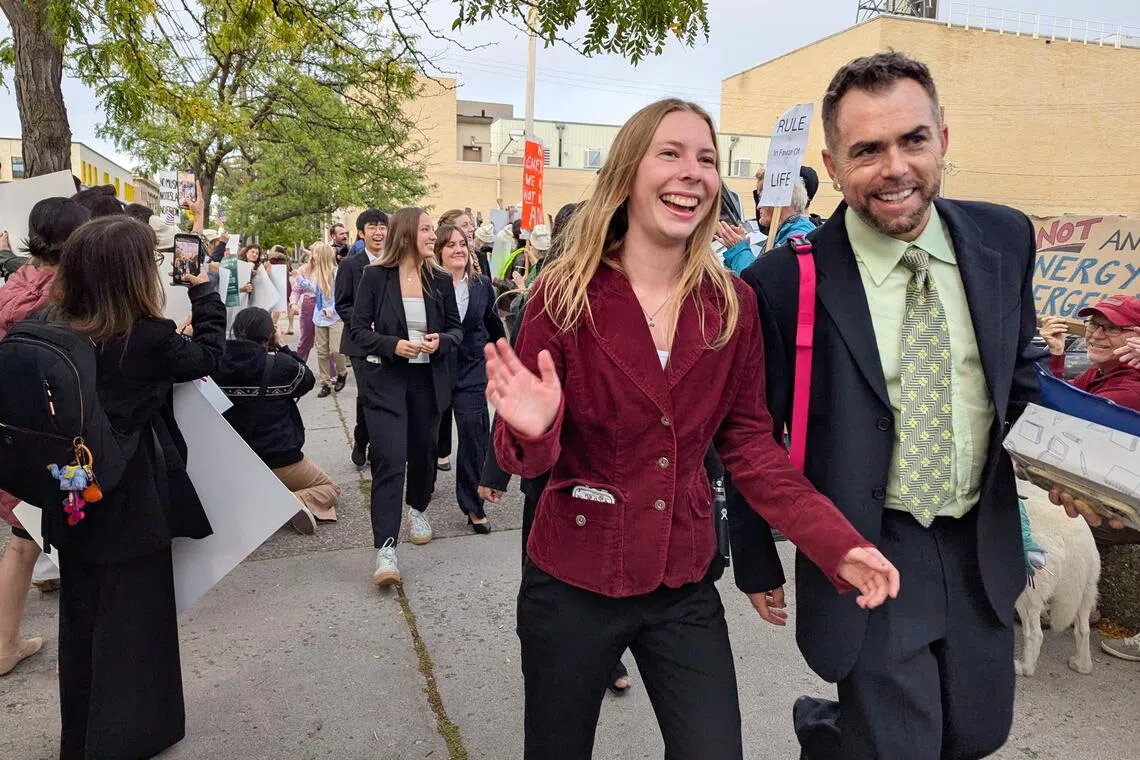 Eva Lighthiser (second from right), along with other plaintiffs in the Lighthiser v. Trump case, arrive at the Russell Smith Courthouse in Missoula, Montana, Sep 16, 2025. A group of young Americans say President Donald Trump is trampling their inalienable rights through an aggressive push for fossil fuels and a crusade against federal climate science. 