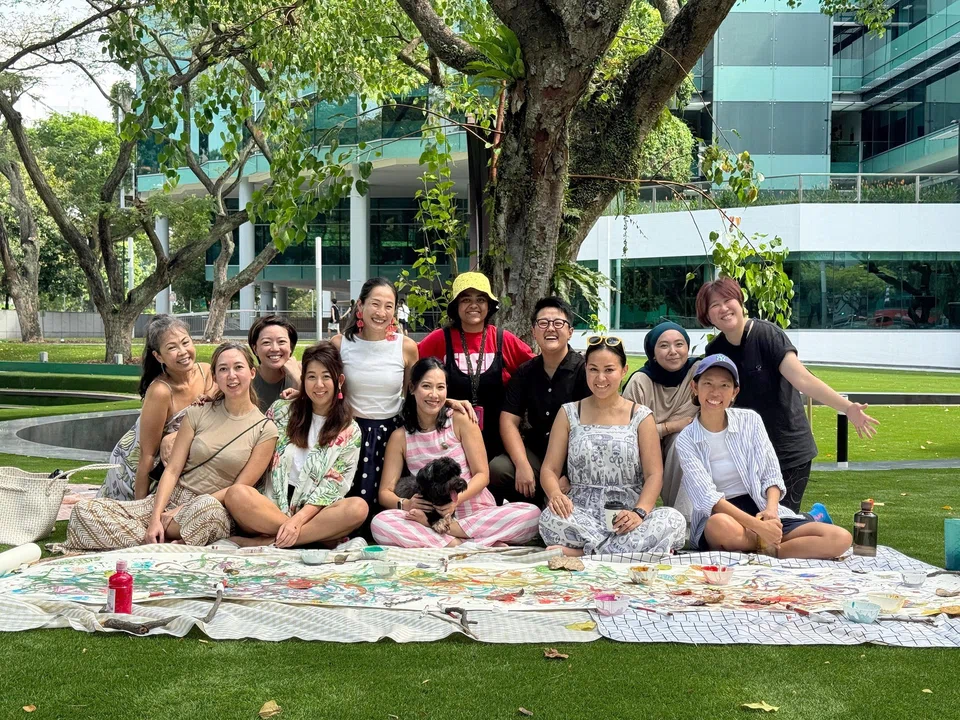 Tiziana Tan (centre, in pink) started an informal women's lunch group in 2023, that has now expanded to comprise over 70 women.
