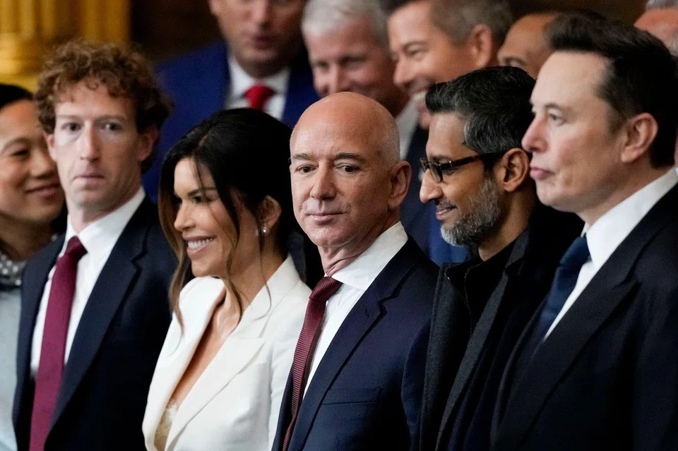 From left: Mark Zuckerberg, CEO of Meta Platforms; Lauren Sanchez, Jeff Bezos' fiancee; Jeff Bezos, founder of Amazon.com.; Sundar Pichai, CEO of Alphabet; and Elon Musk, CEO of Tesla, at the presidential inauguration in the US Capitol in Washington, DC, on Jan 20. 