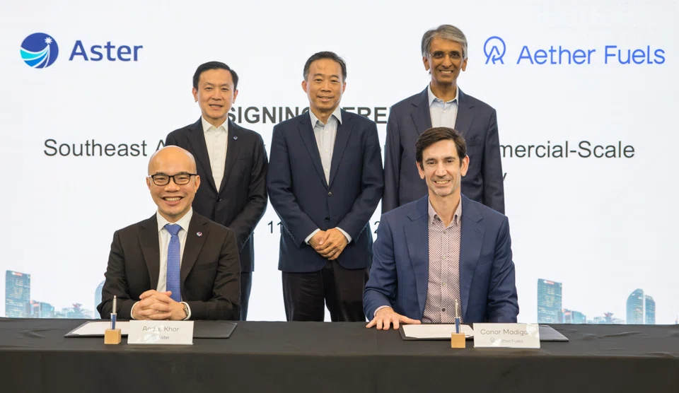 At the signing ceremony of a sustainable aviation fuel deal are Aster's group CFO Andre Khor (seated, left) and Aether Fuels' CEO Conor Madigan (seated, right).