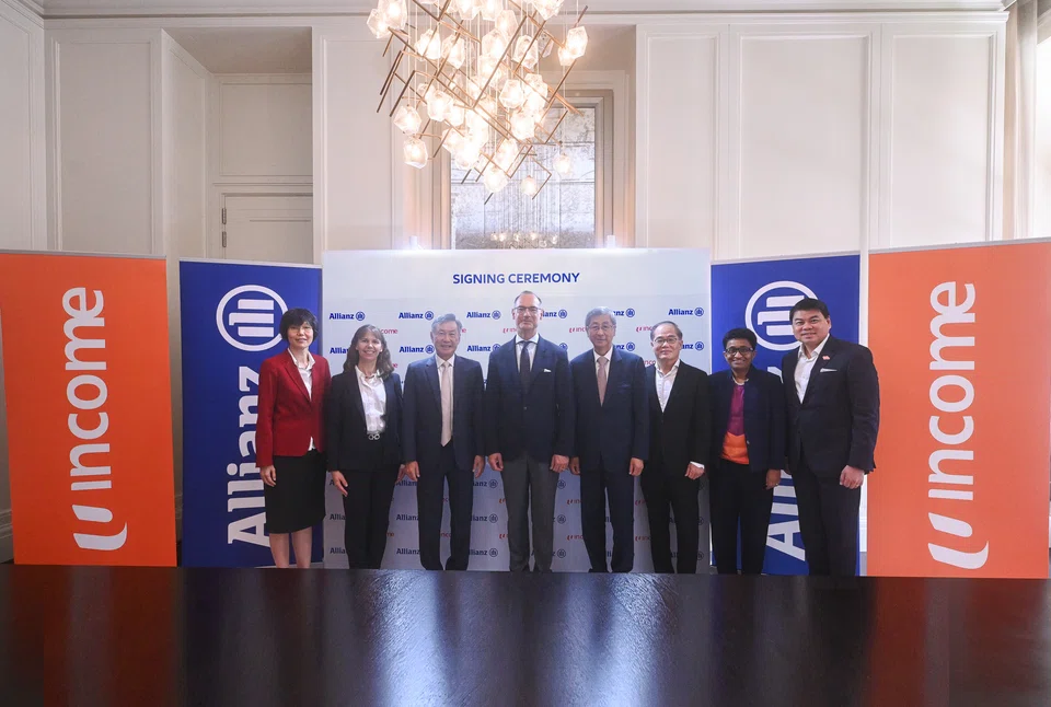 From left: NTUC Enterprise CEO Adeline Sum; Allianz board member Renate Wagner; Income's board chair Ronald Ong; Allianz CEO Oliver Baete; NTUC Enterprise Co-operative and Temasek chair Lim Boon Heng; NTUC Enterprise's deputy chair Kee Teck Koon; Allianz Asia Pacific's regional CEO Anusha Thavarajah; and Income CEO Andrew Yeo.