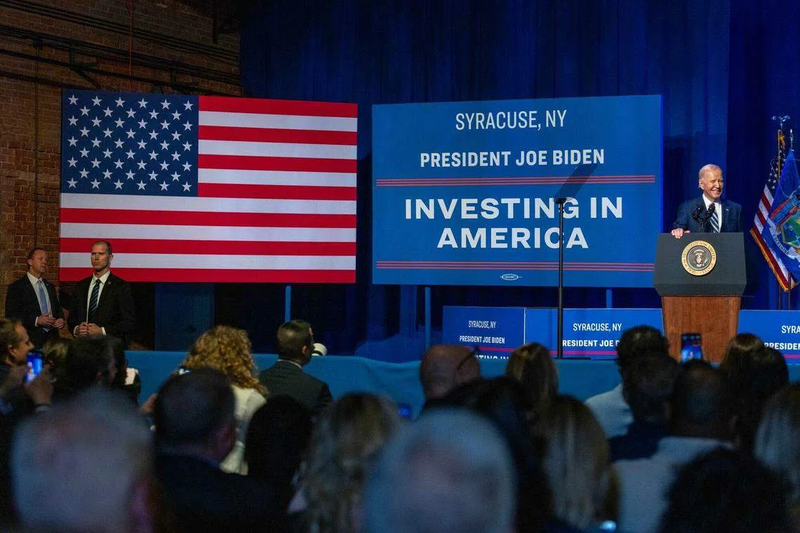 US President Joe Biden, right, at the Milton J Rubenstein Museum of Science and Technology in Syracuse, New York, US, on April 25, 2024. The US plans to award Micron Technology Inc as much as US$13.6 billion in grants and loans to help the memory-chip maker build new American factories.
