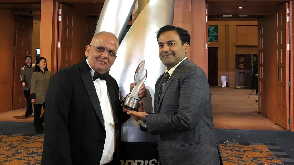 Khaitan International’s chairman and founder Pawan Khaitan (left) with his son, senior executive Manish Khaitan (right), at the 2018 Enterprise 50 Awards.