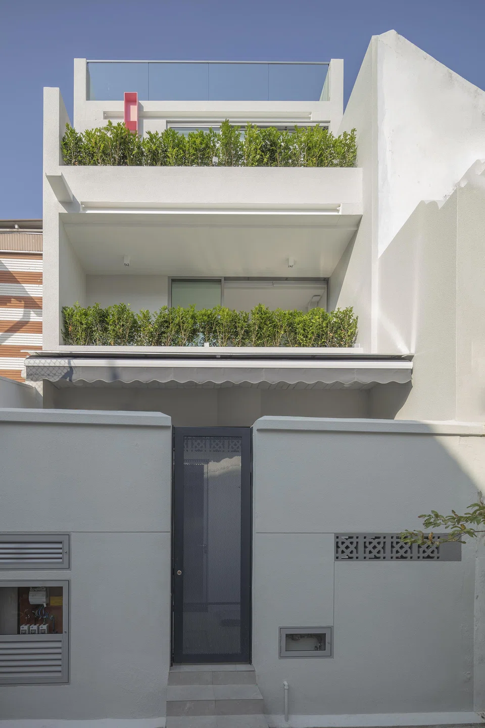 The daughters' bedrooms at the rear extension enjoy balconies and greenery.