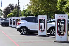 A Tesla electric vehicle charges at a station in Nivelles, Belgium, Aug 26, 2024.  Improvements in the Belgian, Dutch and French EV markets failed to offset a drop of almost 37 per cent in Germany’s battery-electric sales, the European Automobile Manufacturers Association said.