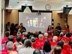 The seniors at Touch's Active Ageing Centre in Yishun singing together at LHN's and Touch's Chinese New Year event on Friday.
