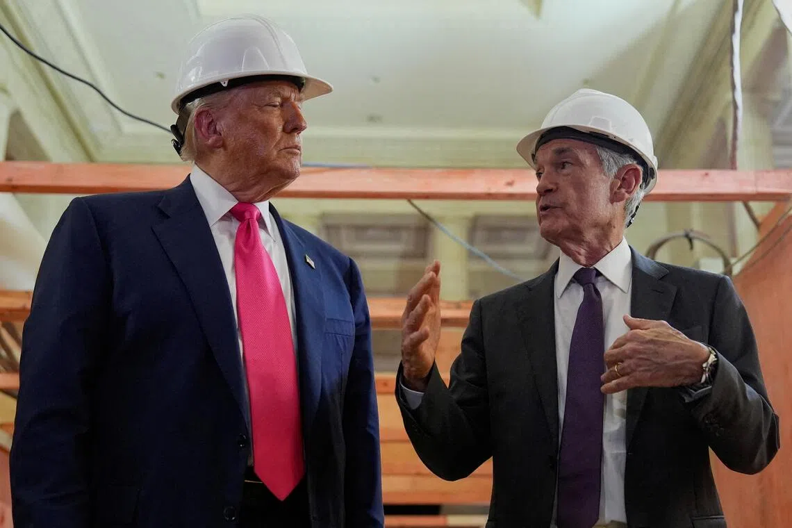 FILE PHOTO: U.S. President Donald Trump and Federal Reserve Chair Jerome Powell speak during a tour of the Federal Reserve Board building, which is currently undergoing renovations, in Washington, D.C., U.S., July 24, 2025. REUTERS/Kent Nishimura/File Photo