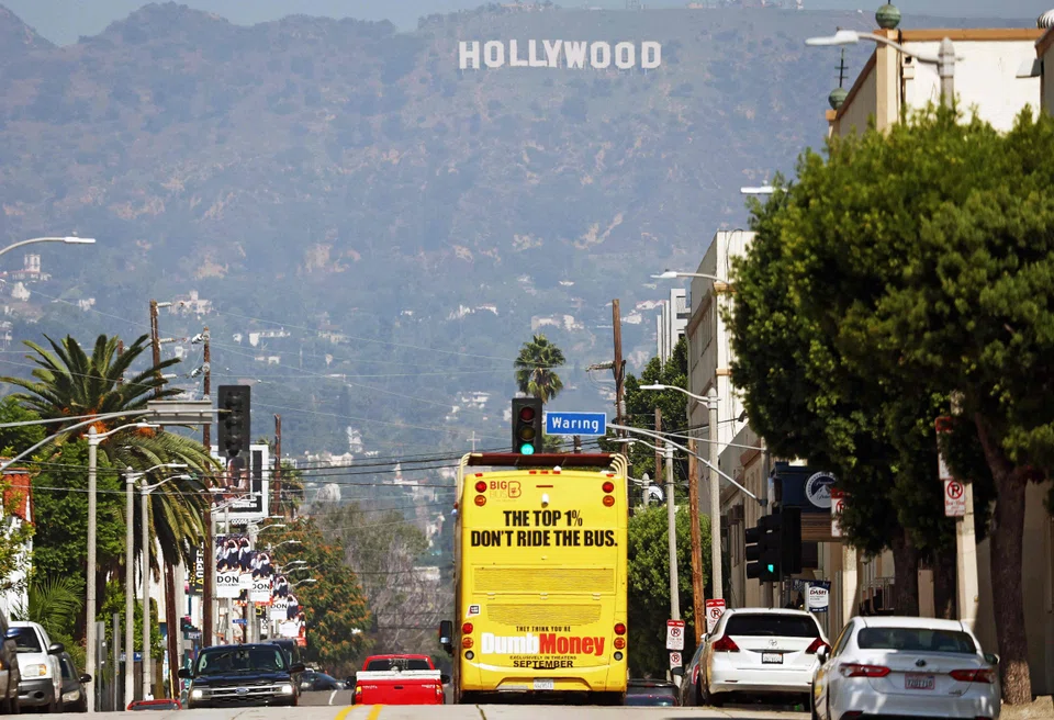 A tour bus in Hollywood advertises the film ''Dumb Money" in September 2023. 