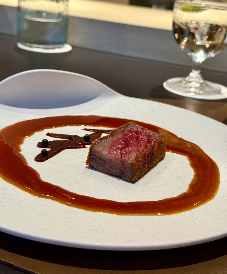 The Miyazazki wagyu katsu and an accompanying kanji character in red miso form the character “wa” in “wagyu”.