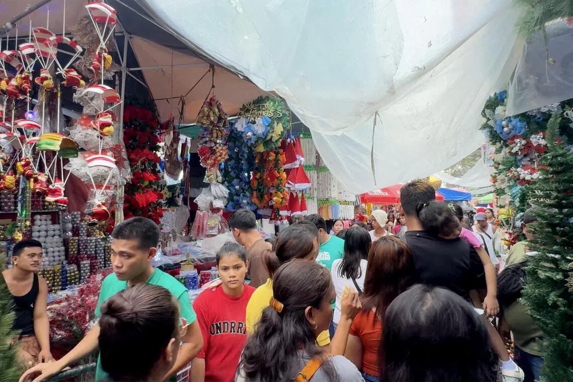 maxmas - Early Christmas shoppers flock to Divisoria market in Manila, Philippines on December 4, 2024.
Credit: Mara Cepeda/ST