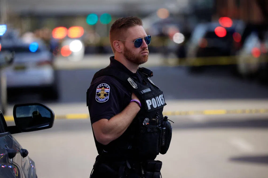 A police officer near the Old National Bank building in downtown Louisville, Kentucky, on Monday (Apr 10). Early reports said there were multiple casualties.