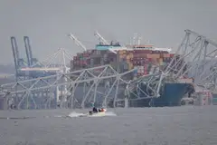 The Francis Scott Key Bridge in Baltimore partially collapses after a container ship runs into it.