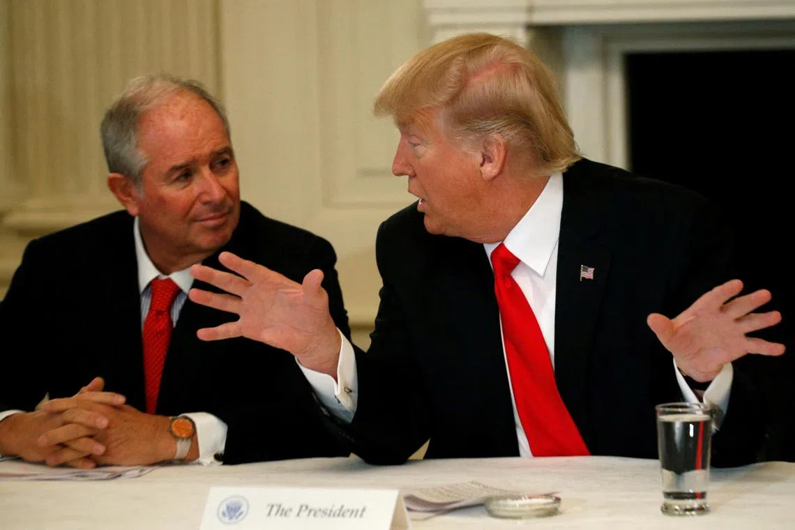 Blackstone CEO Stephen Schwarzman listens to then-US President Donald Trump during Trump's strategy and policy forum with CEOs of major US companies at the White House in Washington, Feb 3, 2017. 
