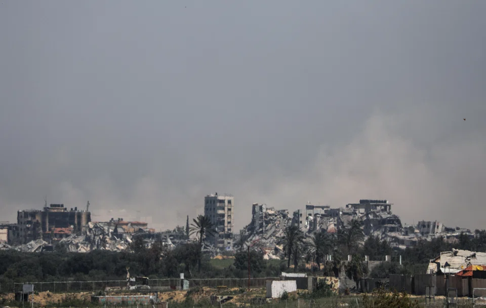 Smoke rises during an Israeli military operation in Al Nuseirat refugee camp, central Gaza Strip, April 17, 2024. All three major rating firms have put out warnings on Israel’s credit score since the onset of the war with Hamas. 