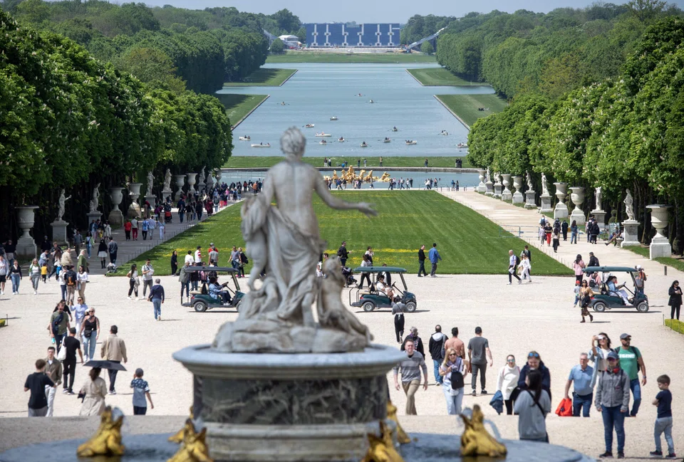 The grandstands for the Olympics' equestrian events are visible in the distance, on the grounds of the Palace of Versailles in Paris.
