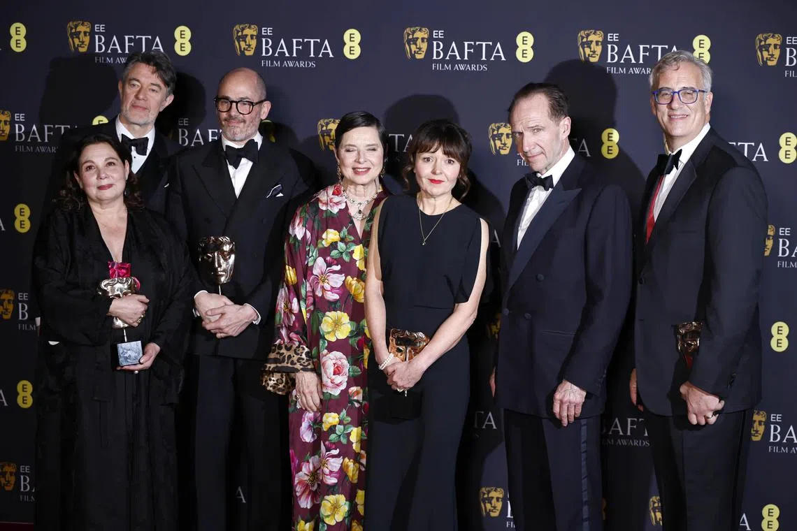 (From left) Tessa Ross, Peter Straughan, Edward Berger, Isabella Rossellini, Juliette Howell, Ralph Fiennes and Michael Jackman pose with the Best Film award for "Conclave" during the Bafta Film Awards at the Royal Festival Hall in London, Britain, on Feb 16, 2025.