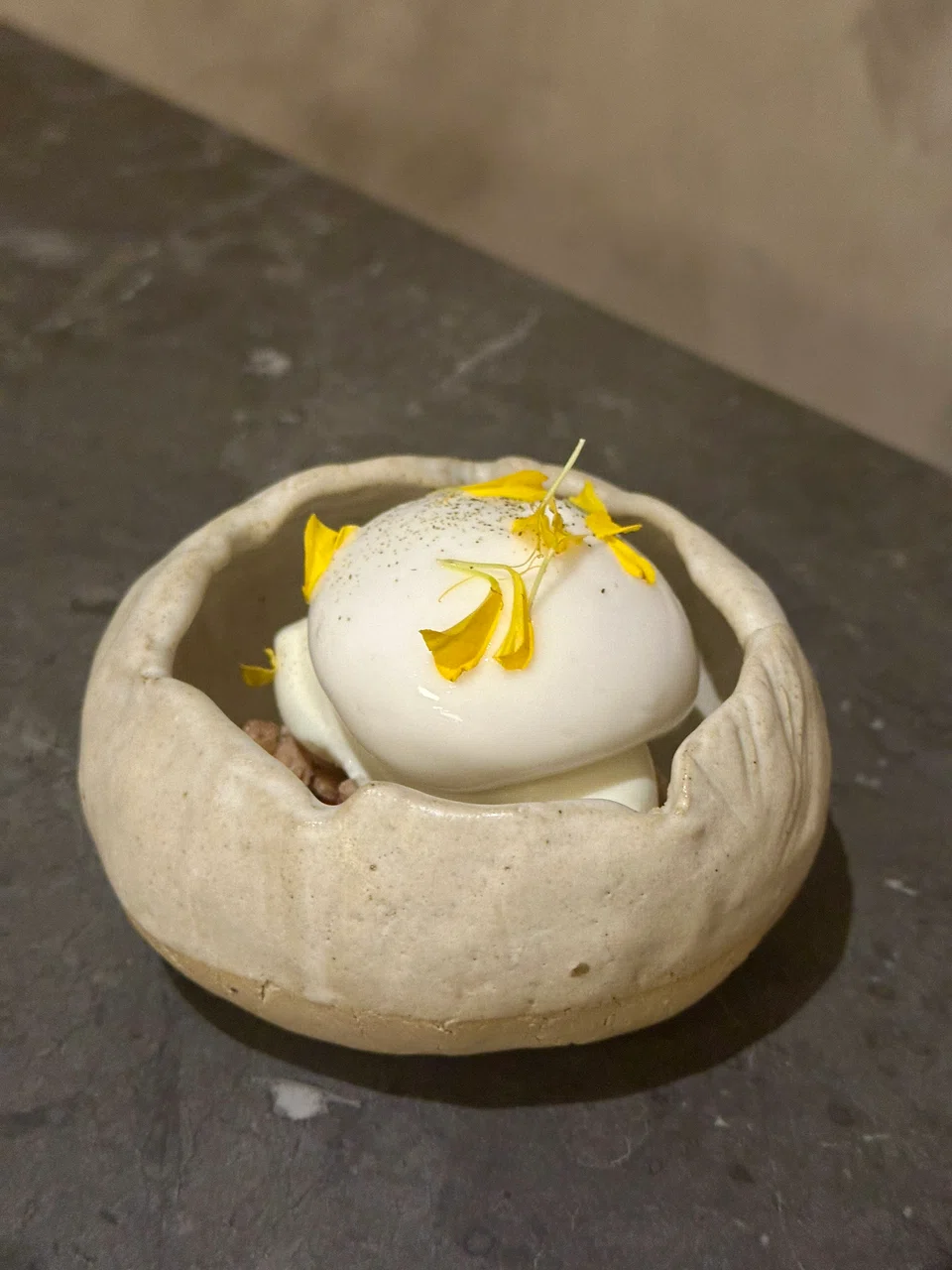 Dessert of raspberrry, granola, milk ice cream and lychee foam.