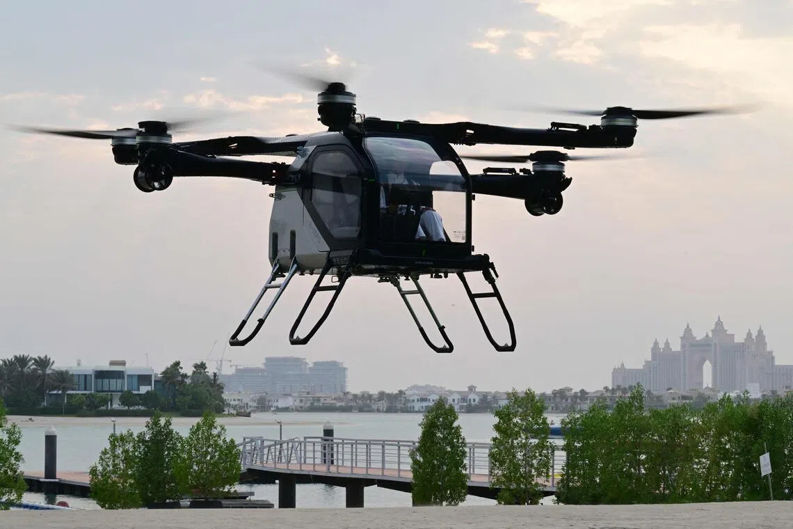 The modular Aridge X3-F (Air Module of the Land Aircraft Carrier) by China's flying car maker Aridge hovers during its presentation and flight demonstration in Dubai on Oct 12.