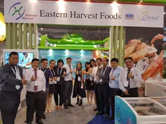Eastern Harvest Foods (Singapore) founder and managing director Derek Cheng (sixth from left) with staff members at an exhibition booth.