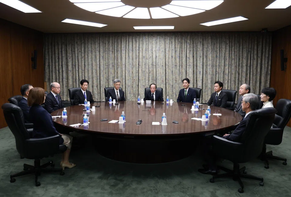 Bank of Japan governor Kazuo Ueda (centre) at a monetary policy meeting with members of the policy board and government officials at the central bank's headquarters in Tokyo, Japan, Oct 30, 2025. 