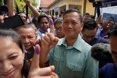 Hun Manet, eldest son of Prime Minister Hun Sen, hails his party’s victory in the elections.