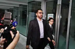 Leader of the Opposition and Workers' Party chief Pritam Singh leaving the State Courts on Oct 22, with one of his lawyers Aristotle Emmanuel Eng Zhen Yang. 