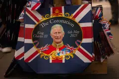 Royal and coronation-related merchandise on sale at a street stall in Picadilly Circus in London, UK, on Sunday, April 30, 2023. The coronation is a religious event which celebrates the start of King Charles III’s reign. 