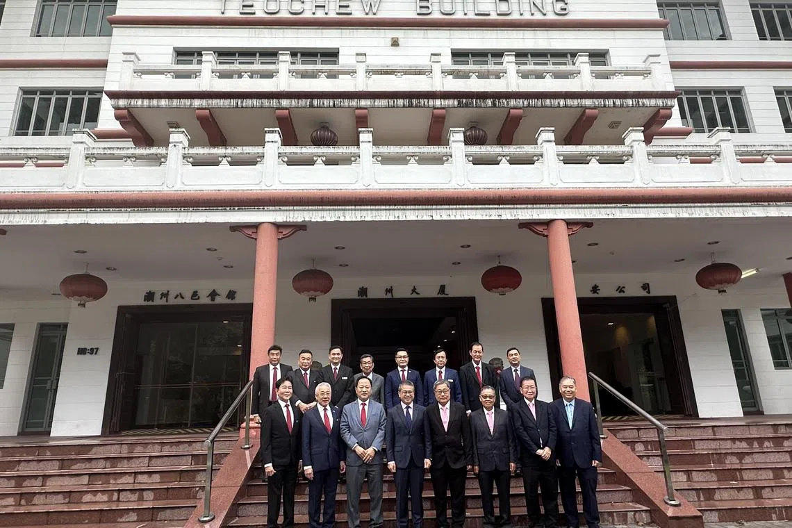 Members of the negotiation teams from Ngee Ann Kongsi and Teochew Poit Ip Huay Kuan with Edwin Tong, Minister for Culture, Community and Youth (front row, fourth from left). The two Teochew groups credit the minister for his advice and for leading the talks between the two sides.