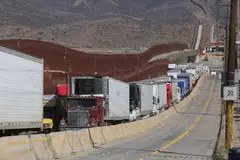 Trailer trucks in Tijuana queuing to cross into the US. Trump’s decision to impose a 25% tariff on Mexican goods will almost certainly push Mexico into a recession, driving more migration northward.