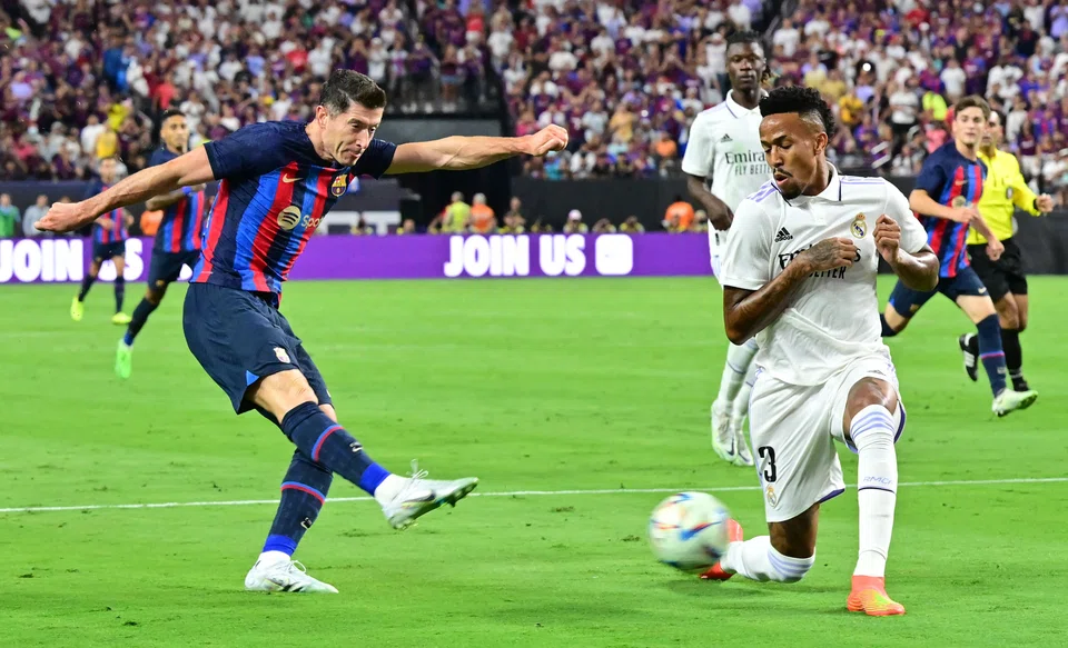 Barcelona's Robert Lewandowski (left) in action against Real Madrid when the 2 Spanish teams last met in July 2022 in Las Vegas.
