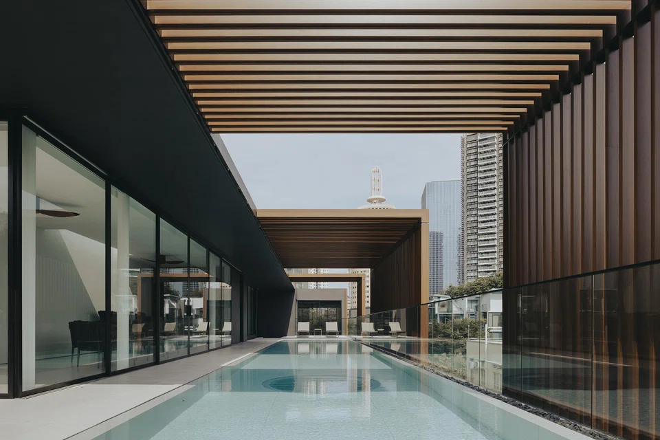 Entertainment spaces look out to the rooftop pool.