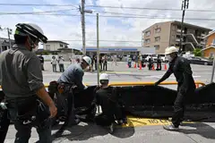 The barrier was put up a week ago in a popular photo spot in Fujikawaguchiko town, where residents had complained about streams of mostly foreign visitors littering, trespassing and breaking traffic rules.