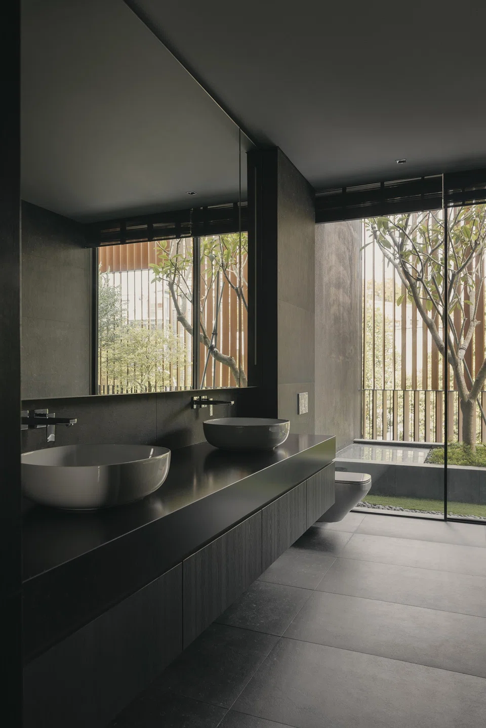 Each bathroom has a view of a small garden.
