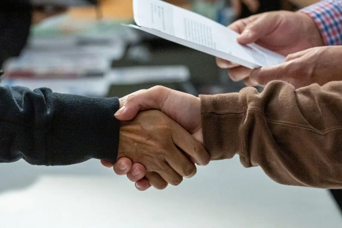 A recruiter and a jobseeker during a Hospitality House career fair in San Francisco. The weak July non-farm payrolls report in the US has indicated an addition of 73,000 jobs, falling short of the market expectation of 110,000 jobs. 