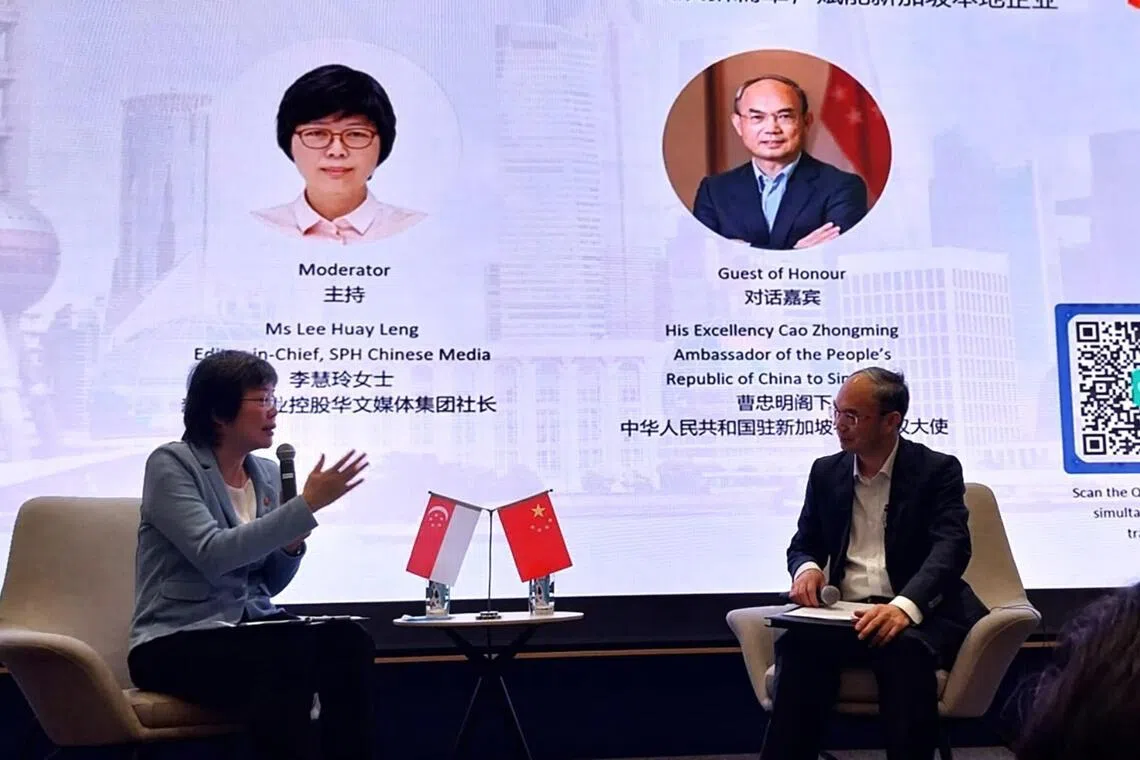 Lee Huay Leng (left), editor-in-chief of the Chinese Media Group at SPH Media, speaking with China's Ambassador to Singapore Cao Zhongming at a fireside chat on Mar 23.