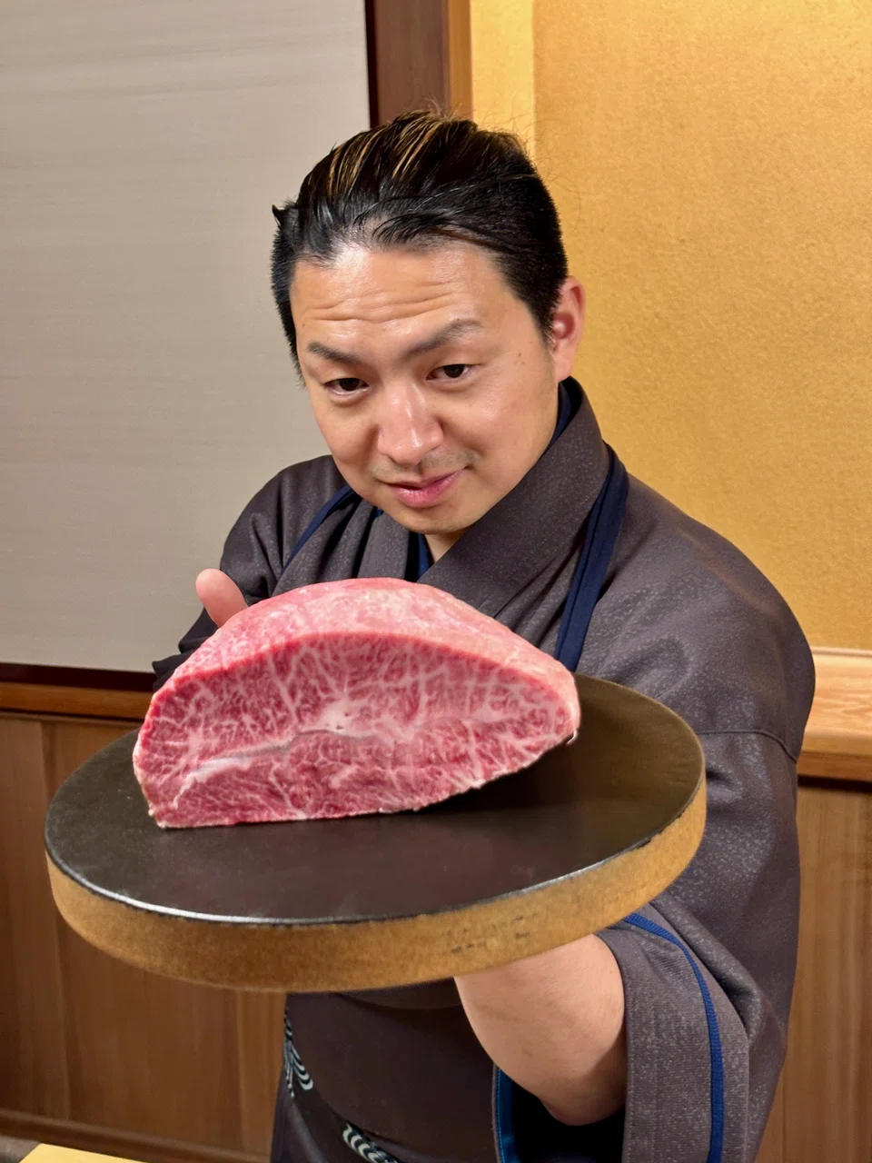 Takehiro Gejo serves wagyu, an unconventional ingredient in a sushi restaurant.