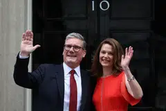 Britain's incoming Prime Minister Keir Starmer and his wife Victoria pose on the steps of 10 Downing Street in London. He promised to fight to restore trust in politics and serve all voters.