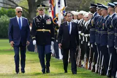US President Joe Biden and Japanese Prime Minister Fumio Kishida review the honour guard during an official ceremony in Washington.