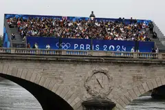 Spectators at the Paris 2024 opening ceremony on Jul 26.