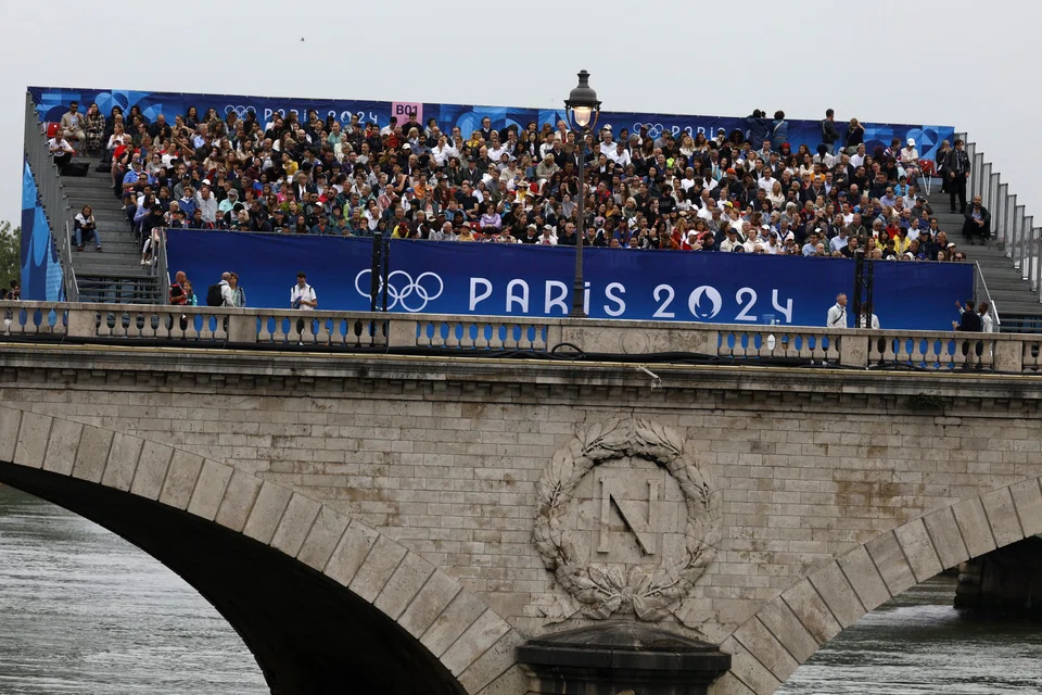Spectators at the Paris 2024 opening ceremony on Jul 26.