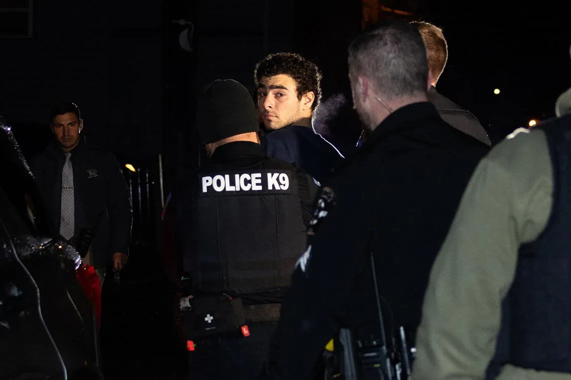 Luigi Mangione is escorted by police to his arraignment at the Blair County Courthouse in Hollidaysburg, Pennsylvania, Dec 9, 2024. 