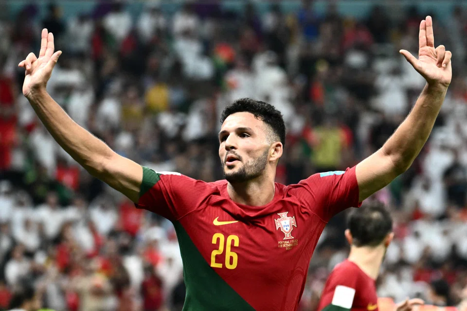 Portugal striker Goncalo Ramos celebrating after scoring his team's fifth goal to complete his hat-trick in the 6-1 win over Switzerland.