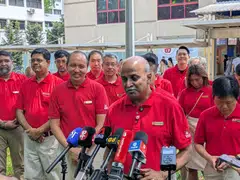 SDP chairman Paul Tambyah, flanked by vice-chairman Bryan Lim (left) and Marsiling-Yew Tee GRC candidates Dr Gigene Wong (right) and Jufri Salim (not pictured), led the party’s manifesto announcement.